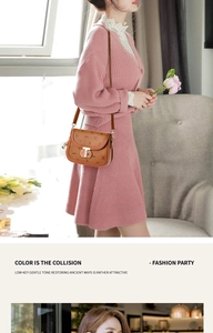 Detail of brown saddle bag with vintage bear print and golden twist lock on pink dress