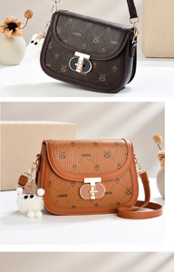 Macro view of lychee leather texture and rabbit pattern on these saddle bags