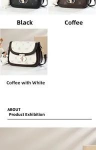 Detail view of leather saddle bag with gold clasp and bunny motif in black and coffee