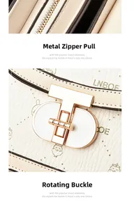 Detail of lychee pattern leather saddle bag with T-shaped rotating lock and zipper