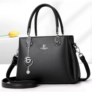 Detail of David Jones Paris handbag with lychee texture and heart crystal pendant