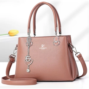 Pink faux leather tote bag with heart charm and David Jones Paris logo on gray background