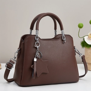 Dark brown lychee pattern leather handbag with star charm and silver hardware straps