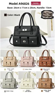 Detail view of large capacity faux leather tote bag showing pocket buckles and multiple colors