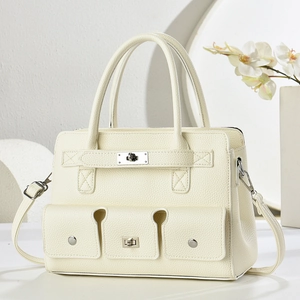 Elegant off-white lychee leather tote bag with functional pockets and silver hardware