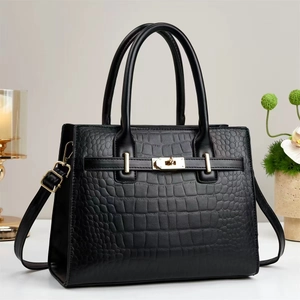 Elegant black crocodile texture handbag with gold hardware and top handles