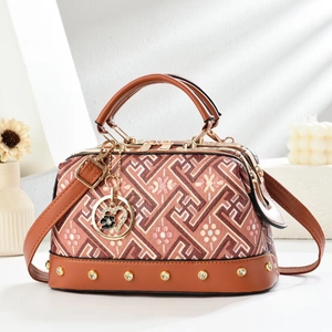 Vintage brown leather and patterned fabric handbag with gold hardware and shoulder strap