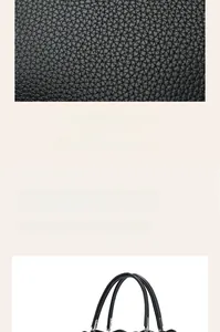 Macro detail of premium black lychee pattern leather on a spacious commuter tote bag