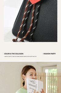 Detail of black pebbled leather handbag with tricolor braided drawstring and heart charm
