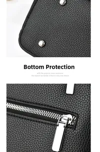 Detail of black pebbled leather handbag with silver protective studs and quality zipper
