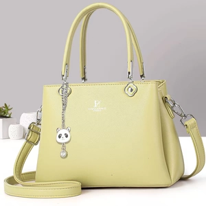 Minimalist light green faux leather crossbody bag with top handle and panda charm