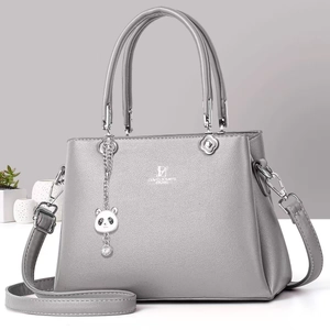 Chic gray textured faux leather tote bag with top handles and adjustable shoulder strap