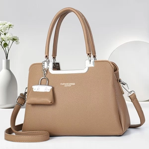 Brown litchi grain leather handbag with silver hardware and adjustable shoulder strap