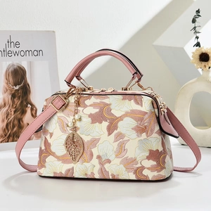 Vintage beige flower embroidered handbag with pink leather handle and gold frame closure