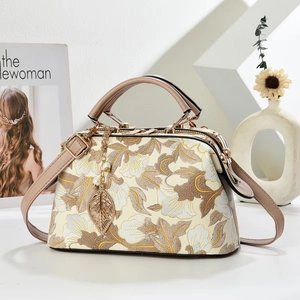 Retro floral embroidery handbag with leather handles and pearl leaf pendant details