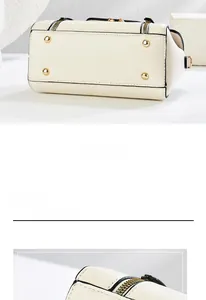Detail showing the bottom of the cream PU leather bag with four gold protective metal studs