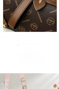 Detail view of brown monogram texture leather bag with brand print and gold buckle