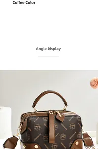 Detail view of coffee-colored leather handbag with floral pattern and gold hardware