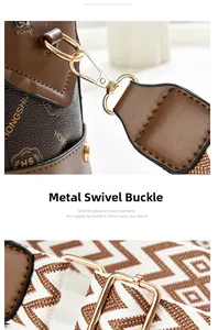 Close-up of golden metal lobster clasp and geometric patterned strap on brown leather bag