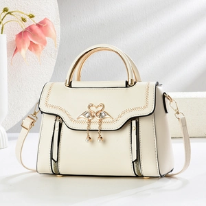 Fashionable cream white crossbody bag with swan crystal buckle and golden hardware