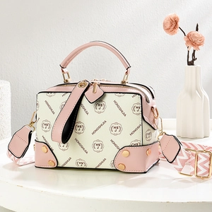 Pink monogram canvas crossbody bag with elegant wide shoulder strap and gold hardware