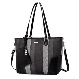 Minimalistische gestreifte Shopper-Tasche für Damen mit schwarz-weißen Paneelen und Leder