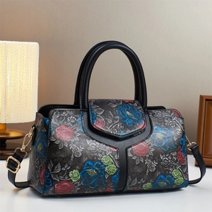 Elegant Boston tote bag with colorful embossed floral patterns and black leather texture