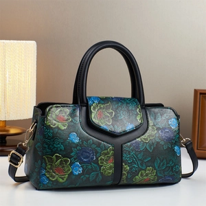 Floral print Boston bag with vintage embossing and detachable shoulder strap in black