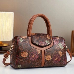 Retro Boston floral handbag in deep brown with colorful embossed patterns and gold hardware