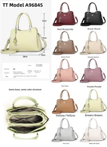 Detailed view of the internal storage and color selection of this PU leather handbag