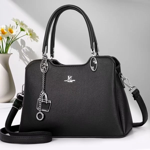 Detail of black lychee grain handbag with David Jones logo and silver lock charm