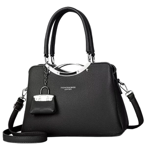 Black pebbled leather tote bag with silver metal circular handles and logo detail