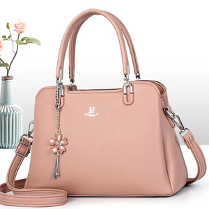 Pink David Jones tote bag with pebbled leather texture and elegant floral pendant