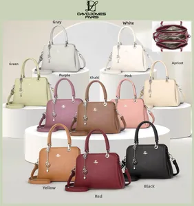 Detailed view of fashionable textured leather handbags in ten colors with heart charms