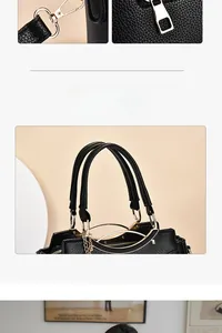 Détail d'un sac à main en cuir grainé noir avec finitions dorées et poignée robuste
