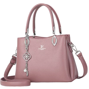 Fashionable mauve pink textured faux leather crossbody bag with floral pendant and double handles