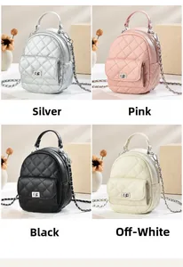 Close-up of quilted mini backpacks in silver, pink, black and beige with chain straps