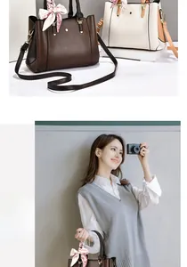 Detail of lychee pattern leather handbag with adjustable strap and silk scarf accent