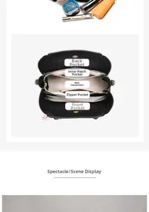 Detailed interior view of black crossbody bag with five storage compartments and gold hardware