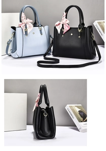 Close-up of litchi texture leather handbag with floral scarf and metal chain strap