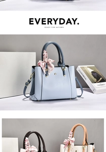 Macro detail of high-quality PU leather handbag featuring floral scarf and metal rivets