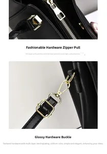 Detail of premium gold-plated zippers and metal buckles on black leather handbag
