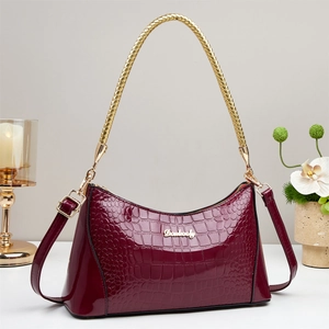 Glossy burgundy crocodile pattern shoulder bag with golden metal handle and Danbooly logo
