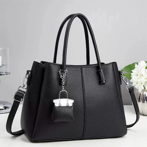 Classic black pebble leather tote bag with silver hardware and detachable shoulder strap