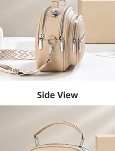 Detail view of beige lychee texture leather handbag with geometric wide shoulder strap