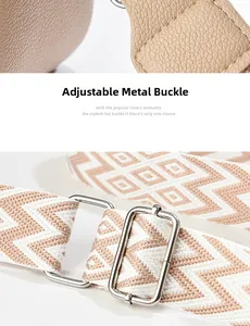 Detail of adjustable geometric weave shoulder strap with silver metallic hardware hooks