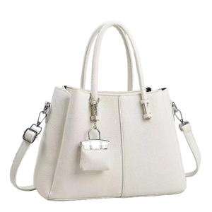 Elegant white litchi grain leather tote bag with dual handles and a mini bag charm