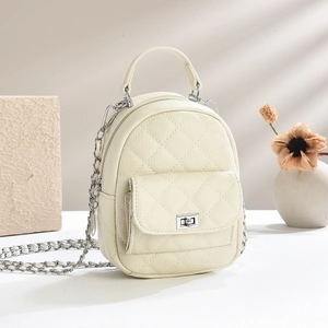 Quilted cream mini backpack with silver chain strap and pebbled leather texture