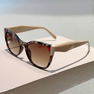 Detail of leopard print frames and brown gradient lenses on trendy sunglasses