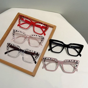 Retro cat-eye blue light glasses in various colors like red and pink with leopard accents